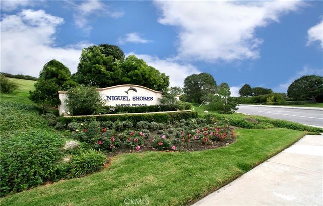 a view of a house with a garden and pathway