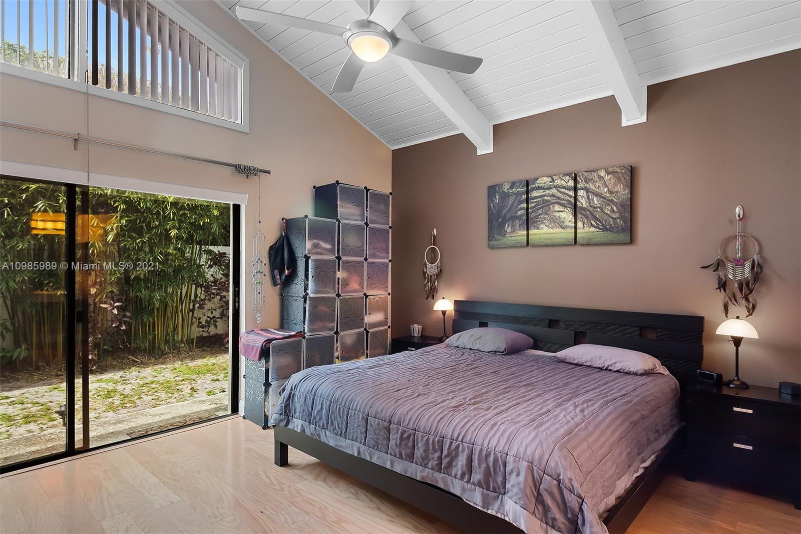 21518 Kapok Circle Boca Raton, FL 33433 - Photo 12 of 30 a bedroom with a large bed and a large window