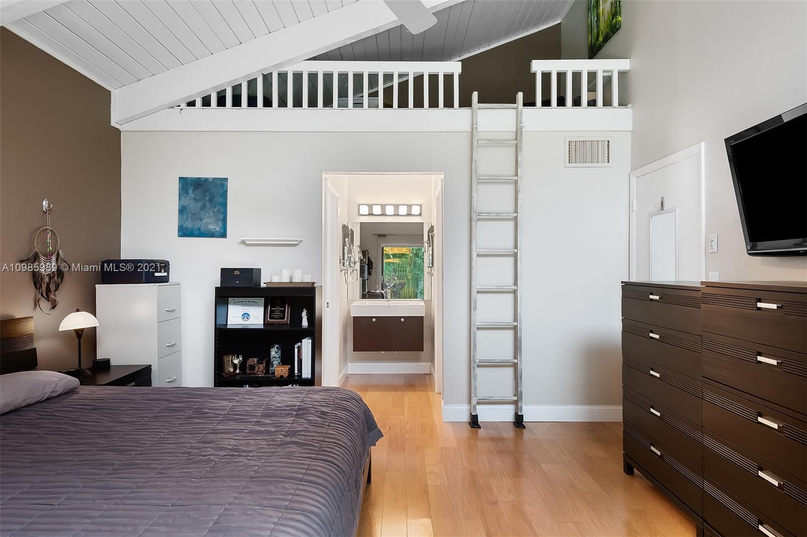 21518 Kapok Circle Boca Raton, FL 33433 - Photo 13 of 30 a bedroom with furniture and a flat tv screen