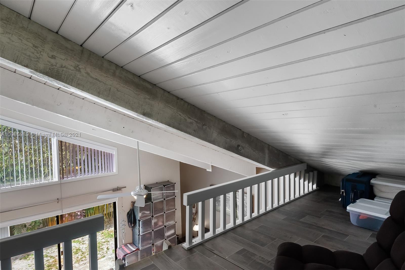 21518 Kapok Circle Boca Raton, FL 33433 - Photo 16 of 30 a view of entryway with workspace and wooden floor