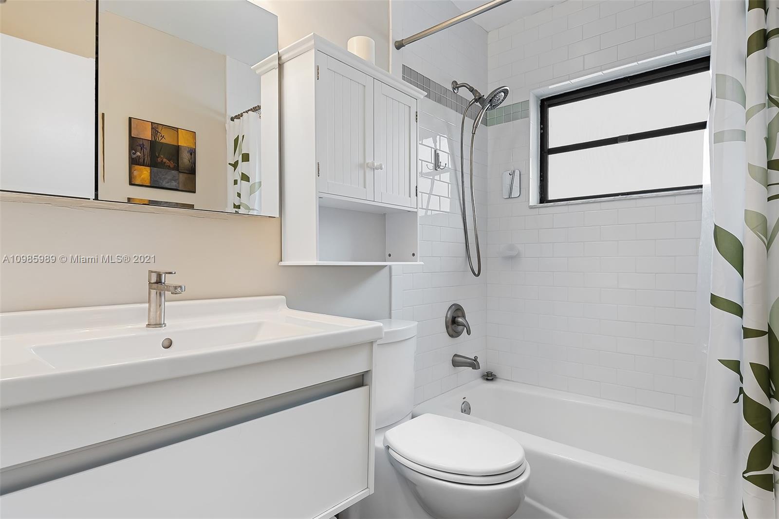 21518 Kapok Circle Boca Raton, FL 33433 - Photo 19 of 30 a bathroom with a sink a toilet and shower