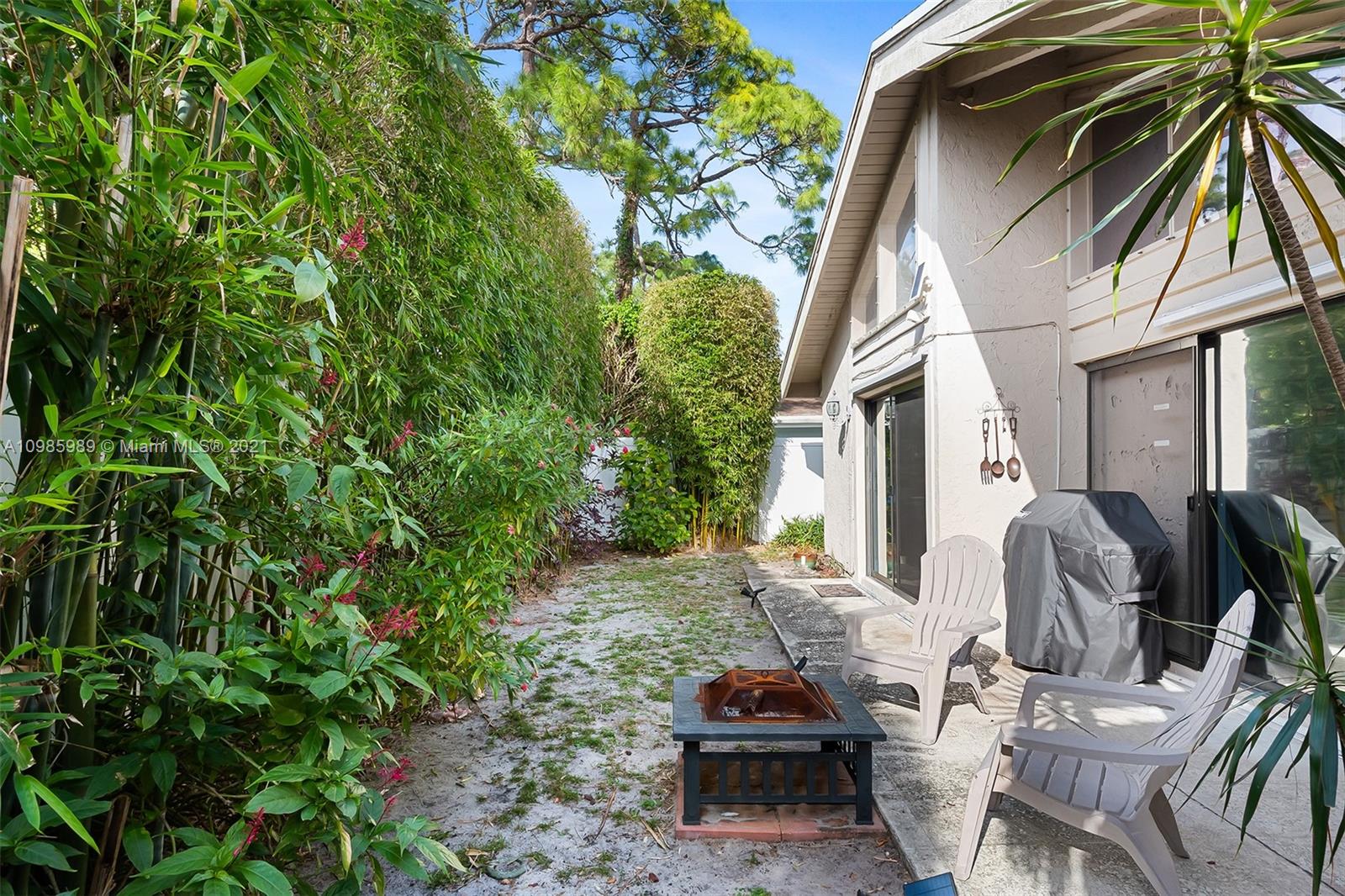 21518 Kapok Circle Boca Raton, FL 33433 - Photo 28 of 30 a view of backyard with outdoor seating and plants