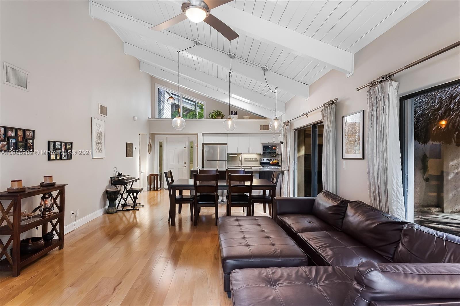 21518 Kapok Circle Boca Raton, FL 33433 - Photo 5 of 30 a living room with lots of furniture and kitchen view