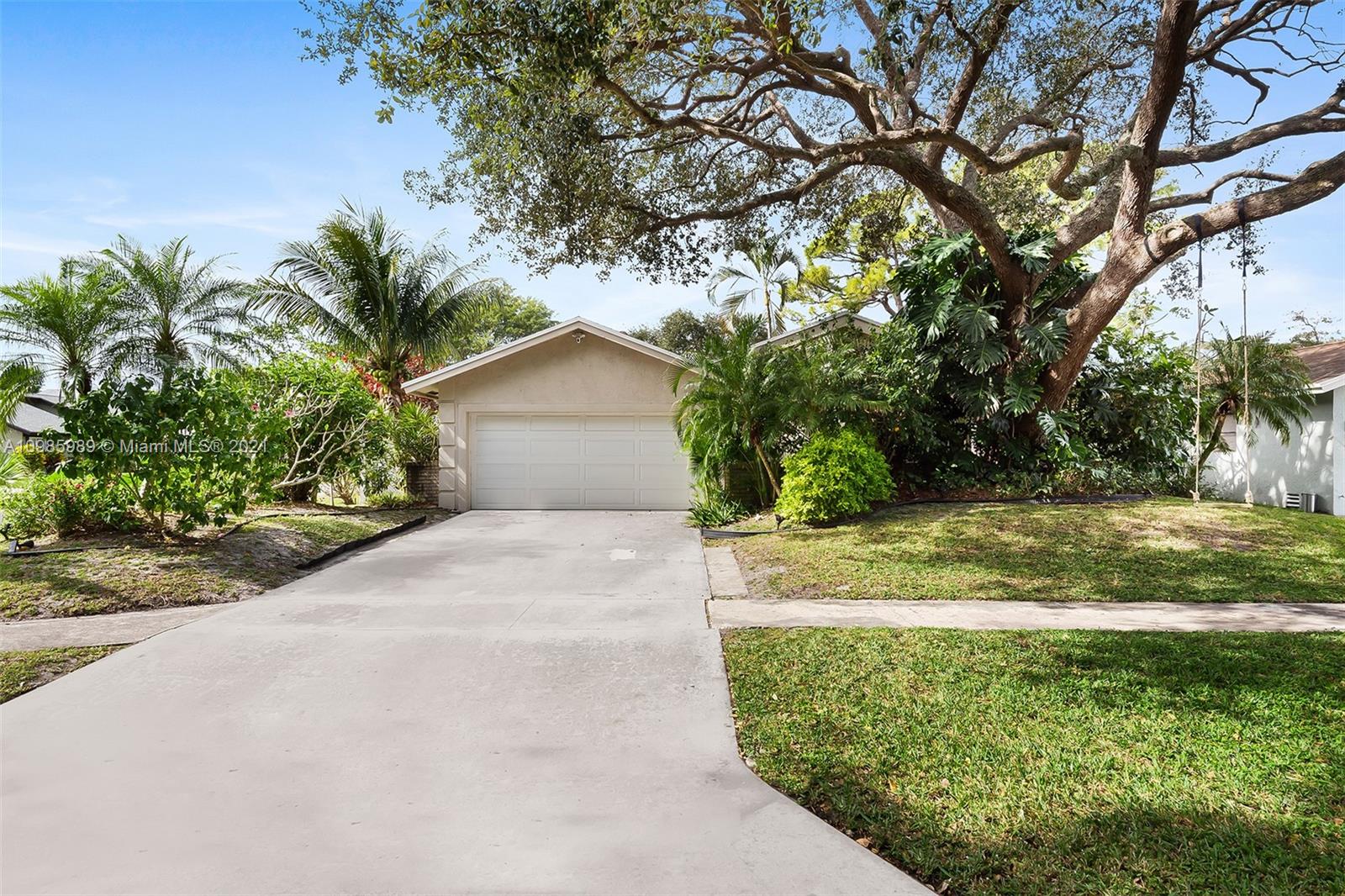 21518 Kapok Circle Boca Raton, FL 33433 - Photo 7 of 30 a view of a house with a yard and large trees