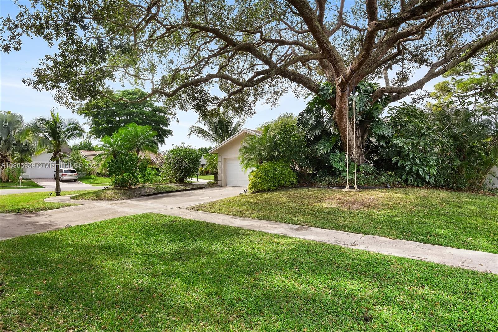 21518 Kapok Circle Boca Raton, FL 33433 - Photo 8 of 30 a view of a yard with a tree