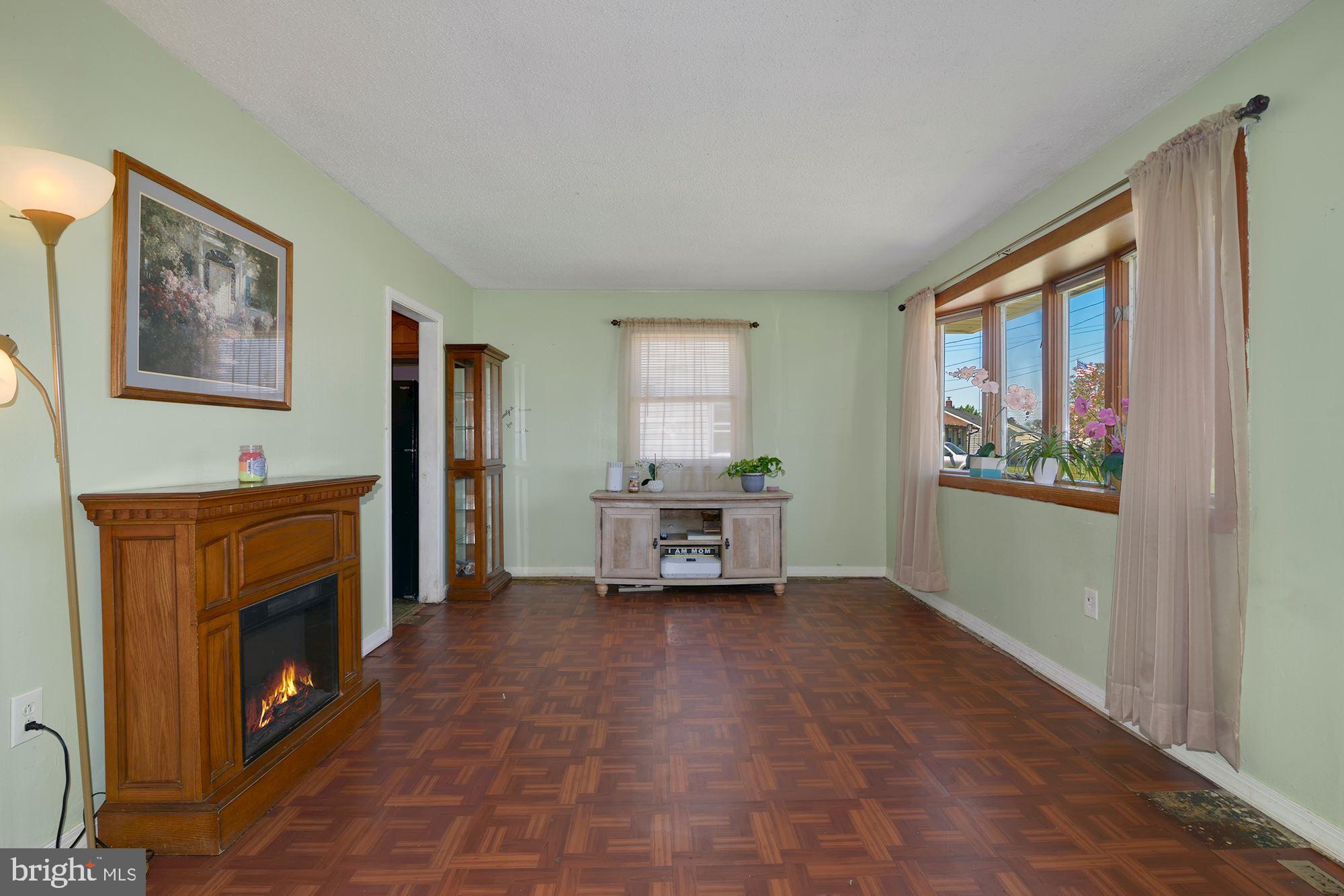 446 Flanders Road Bellmawr, NJ 08031 - Photo 2 of 29 a view of a livingroom with furniture and a fireplace