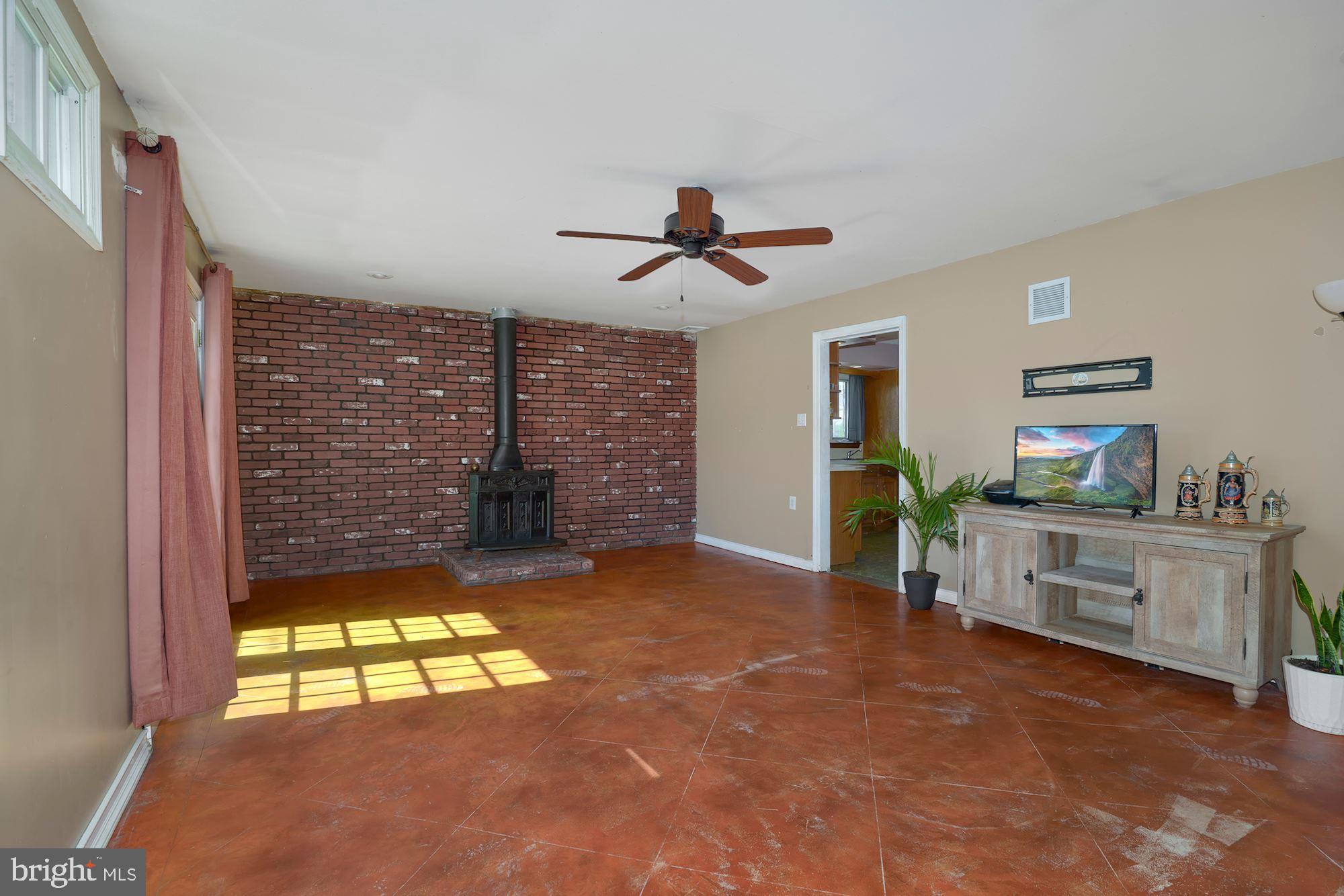446 Flanders Road Bellmawr, NJ 08031 - Photo 11 of 29 a view of an empty room with a window and a kitchen
