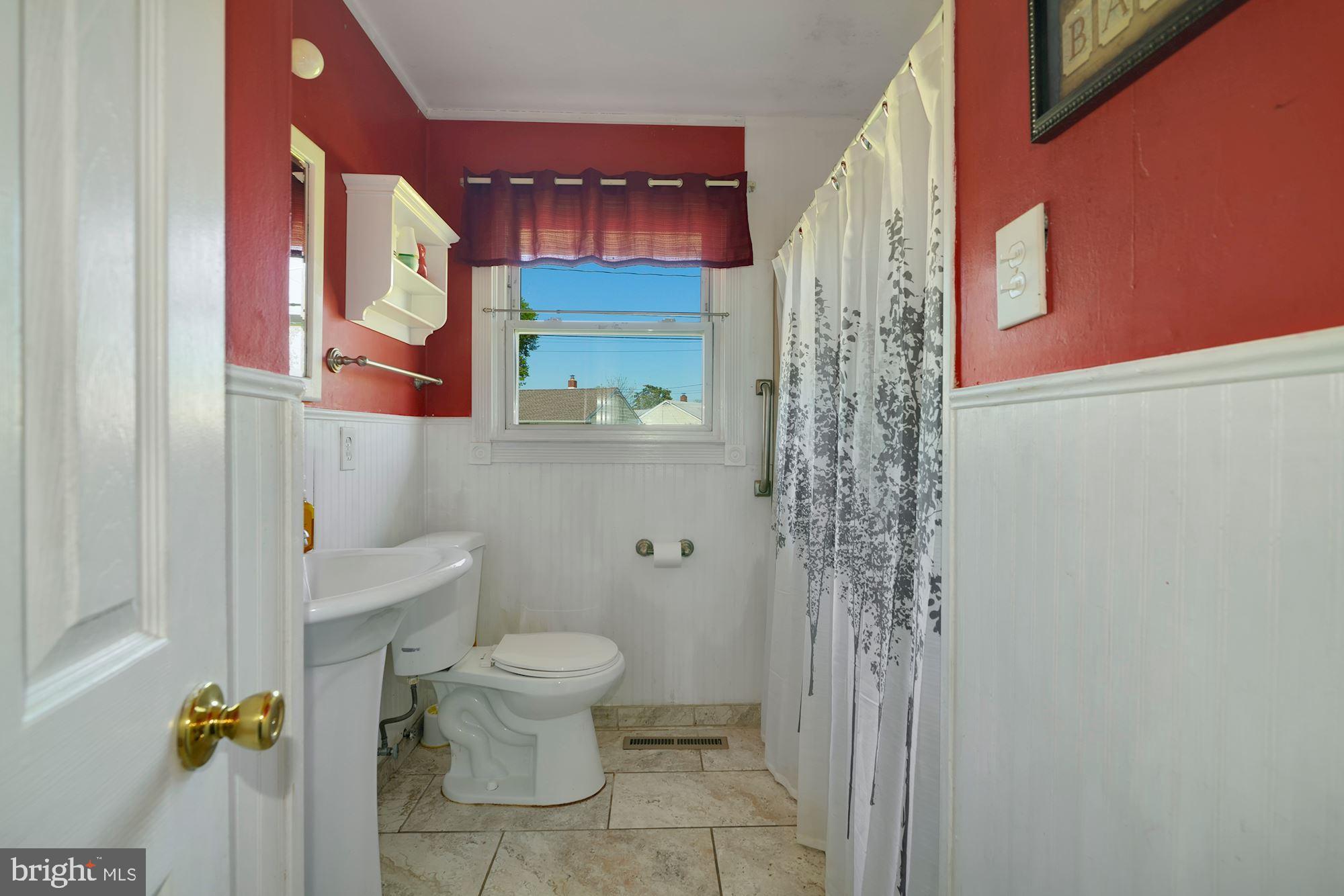 446 Flanders Road Bellmawr, NJ 08031 - Photo 14 of 29 a bathroom with a toilet and a shower