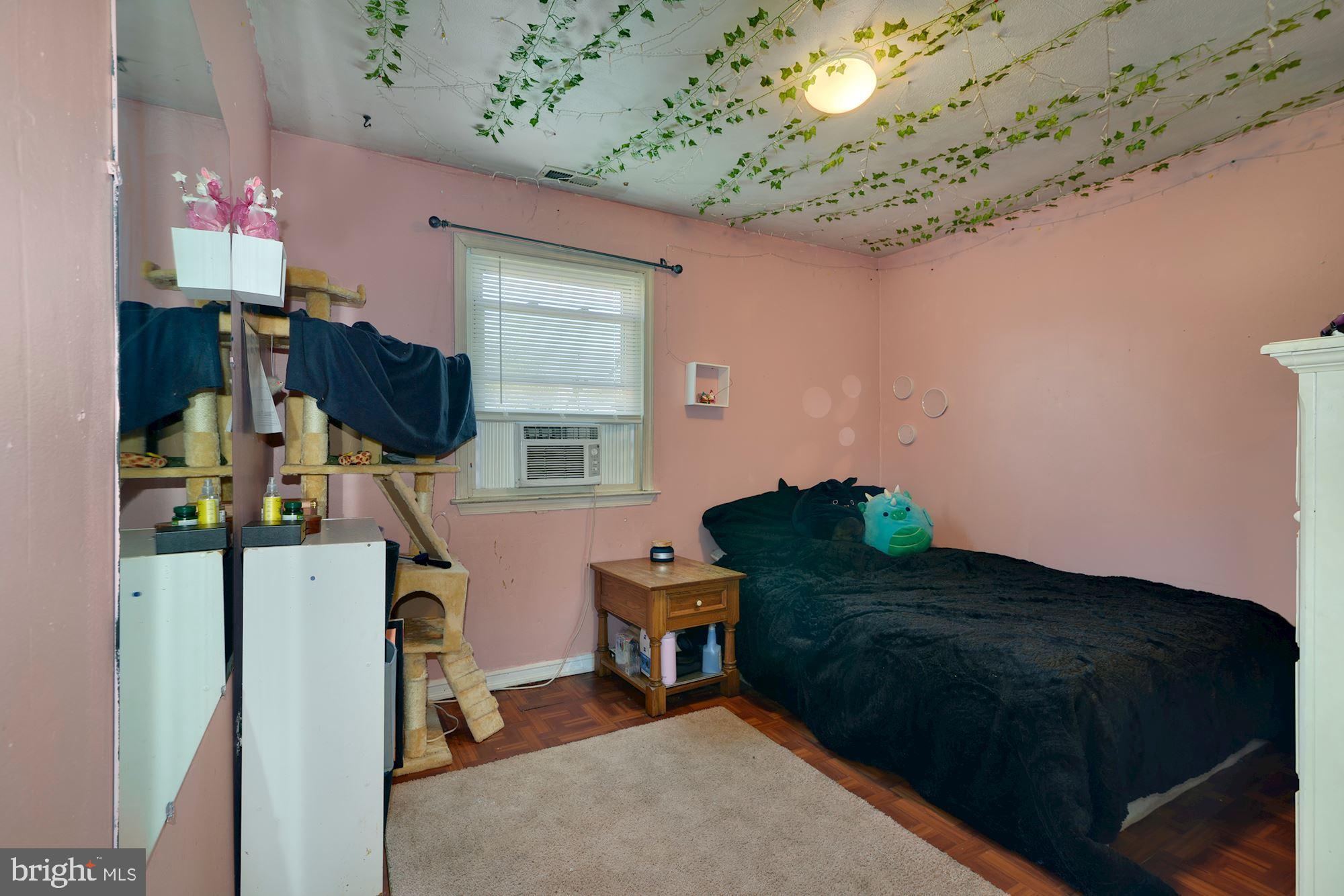 446 Flanders Road Bellmawr, NJ 08031 - Photo 17 of 29 a bedroom with furniture and a chandelier