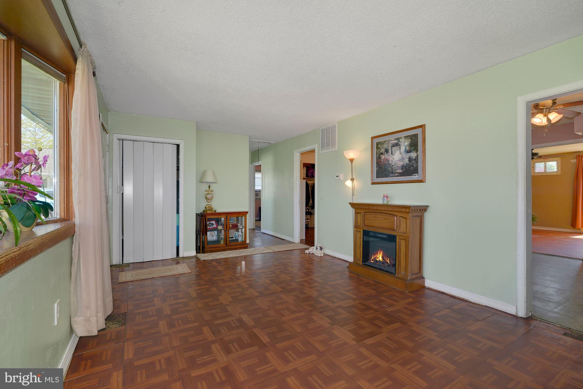 446 Flanders Road Bellmawr, NJ 08031 - Photo 4 of 29 a view of a livingroom with an empty space and a fireplace