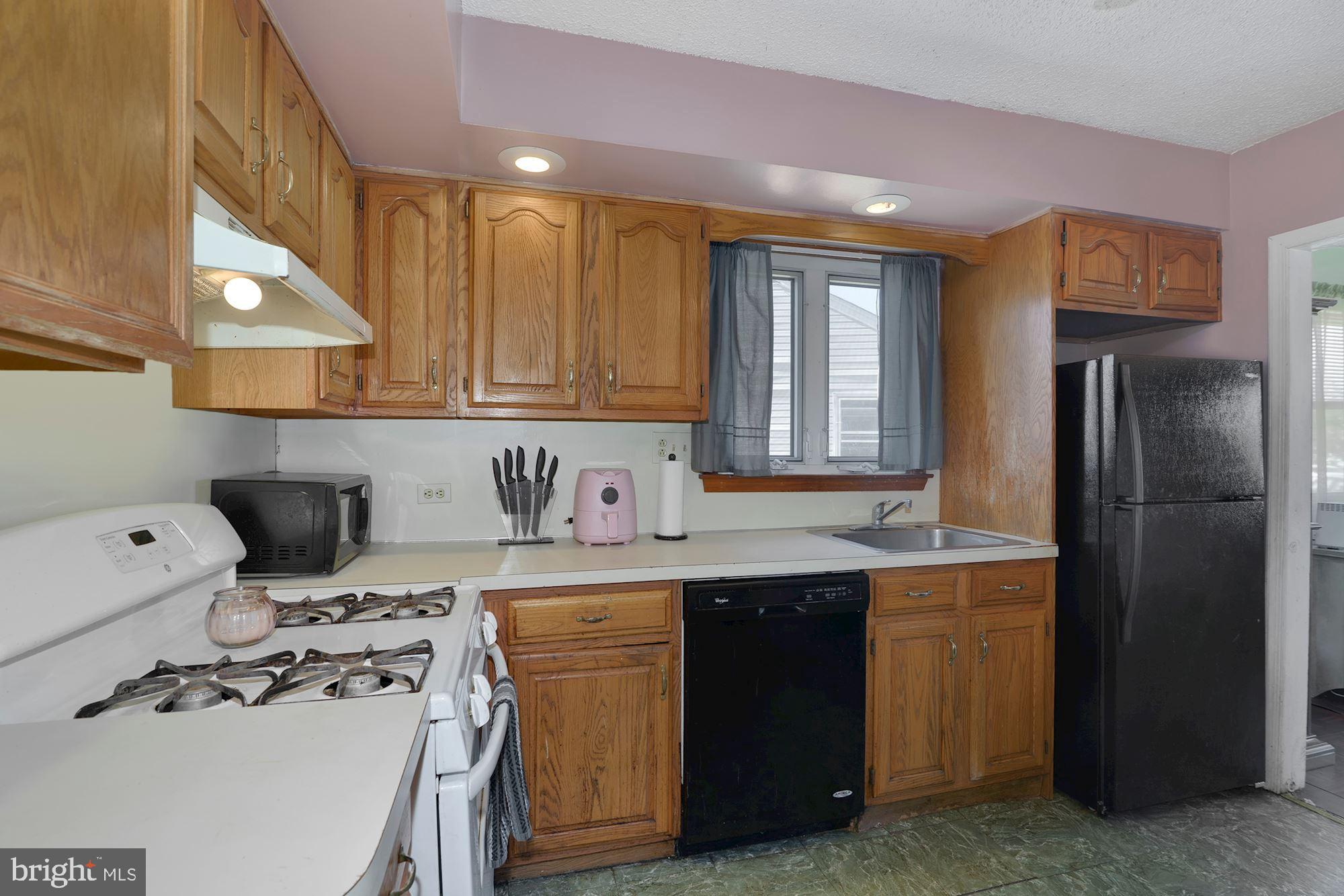 446 Flanders Road Bellmawr, NJ 08031 - Photo 6 of 29 a kitchen with stainless steel appliances granite countertop a sink stove and refrigerator