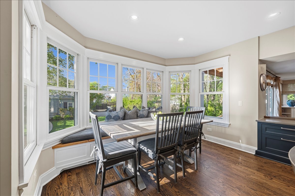 1082 Ash Street Winnetka, IL 60093 - Photo 12 of 54 a view of a dining room with furniture window and wooden floor