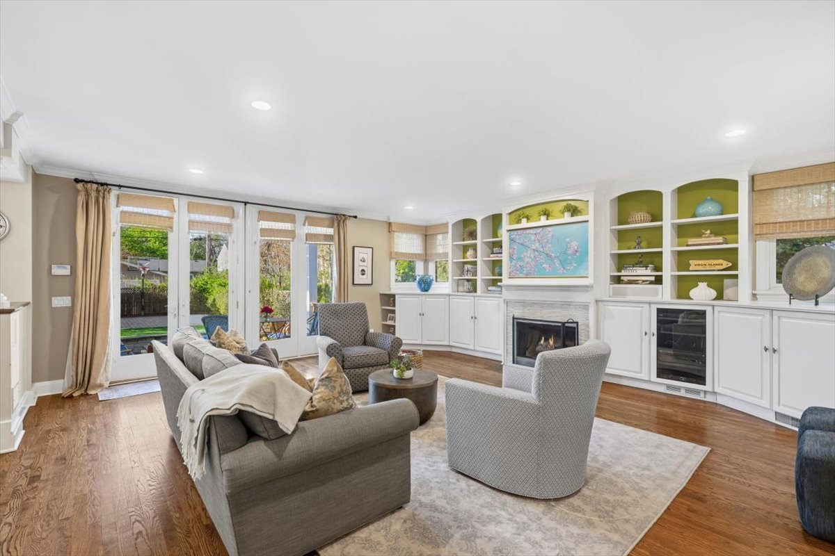 1082 Ash Street Winnetka, IL 60093 - Photo 17 of 54 a living room with fireplace furniture and floor to ceiling windows