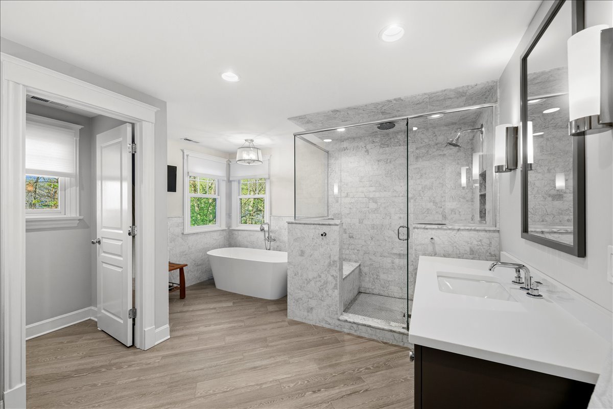 1082 Ash Street Winnetka, IL 60093 - Photo 30 of 54 a bathroom with a bathtub shower sink and toilet