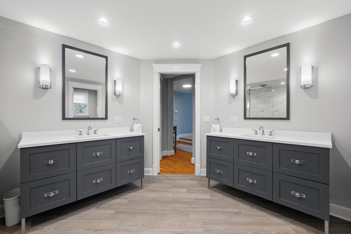 1082 Ash Street Winnetka, IL 60093 - Photo 32 of 54 a spacious bathroom with double vanity sinks and a bathtub