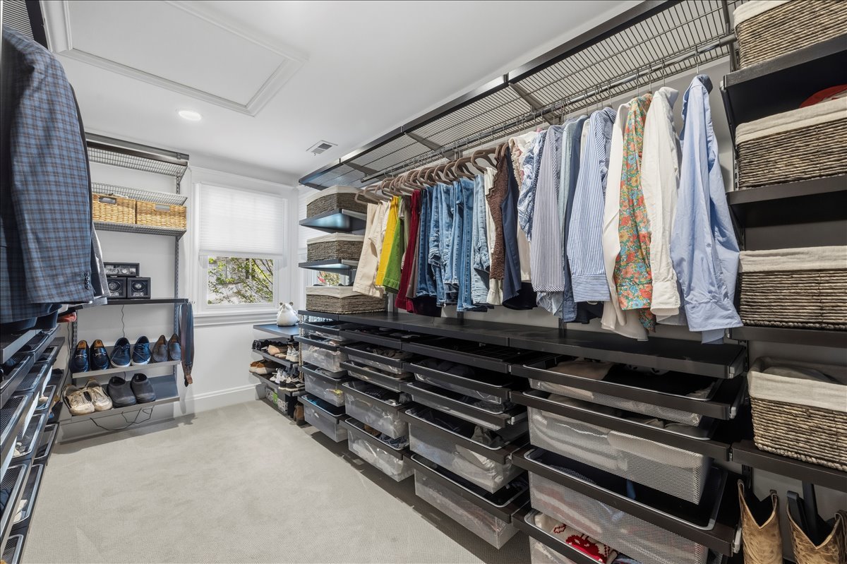 1082 Ash Street Winnetka, IL 60093 - Photo 34 of 54 a view of walk in closet with clothes and shoes