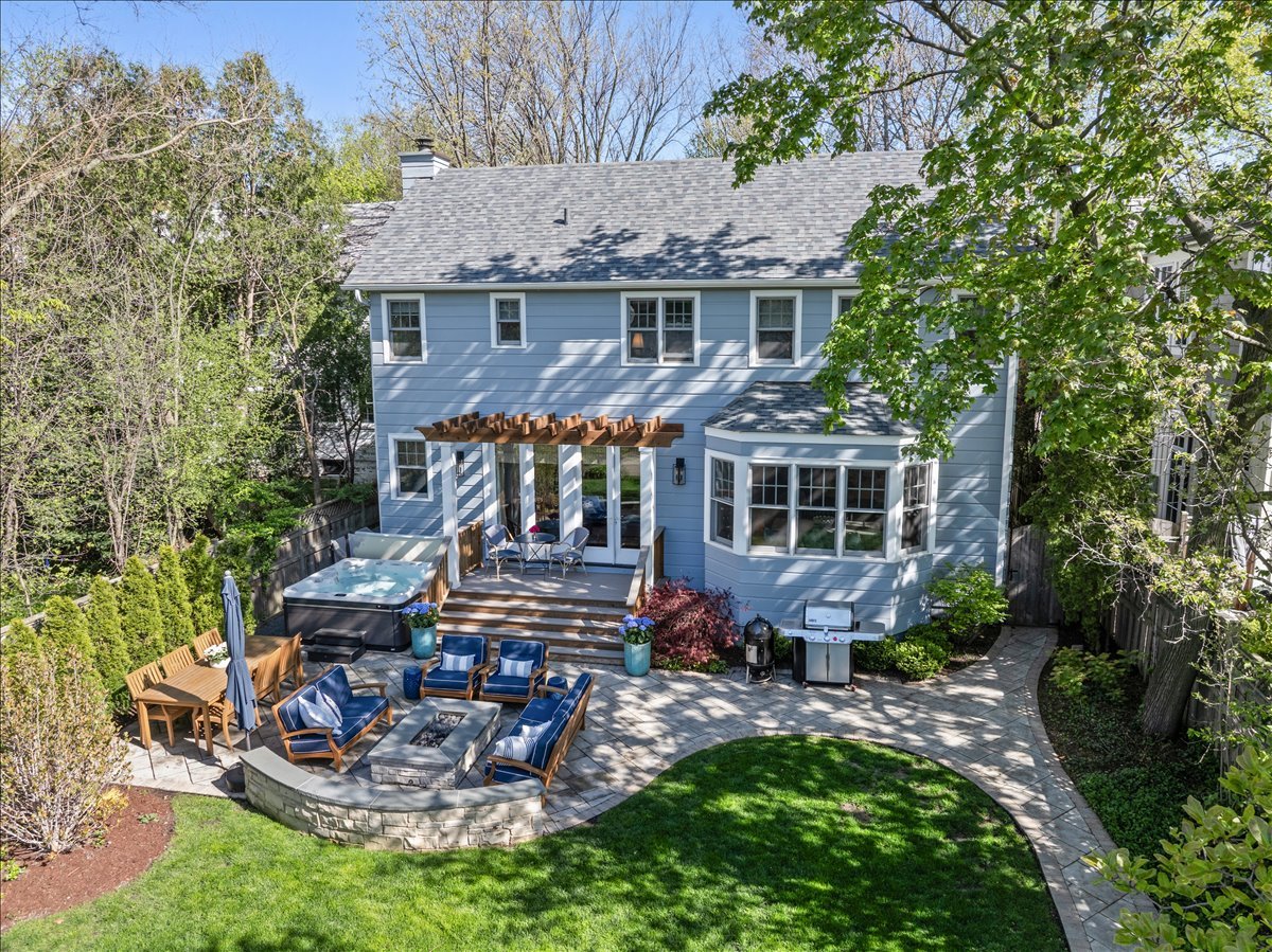 1082 Ash Street Winnetka, IL 60093 - Photo 47 of 54 a front view of a house with garden