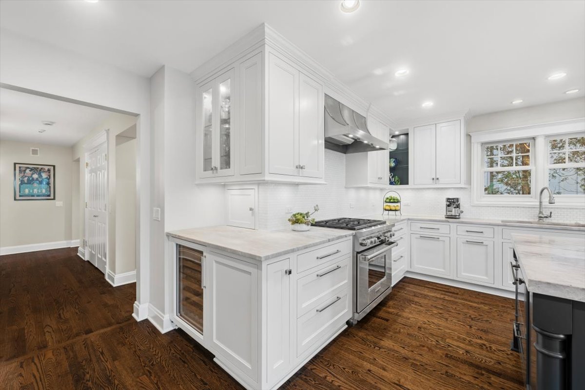 1082 Ash Street Winnetka, IL 60093 - Photo 10 of 54 a kitchen with stainless steel appliances granite countertop a stove a sink dishwasher and a refrigerator