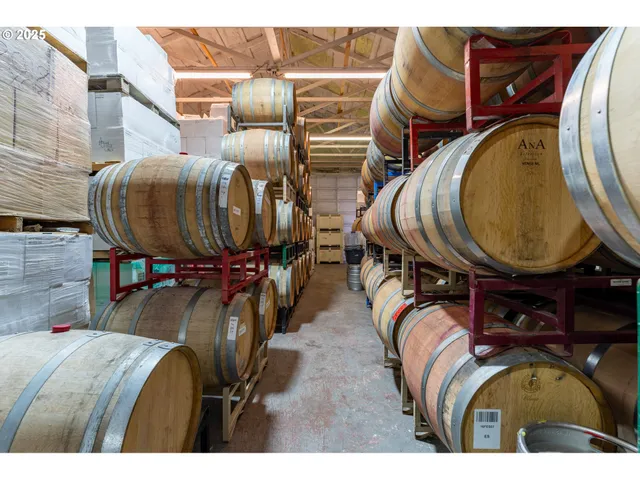 a view of a terrace with a barbeque and wooden stairs