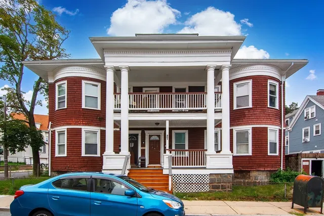 a front view of residential houses with yard