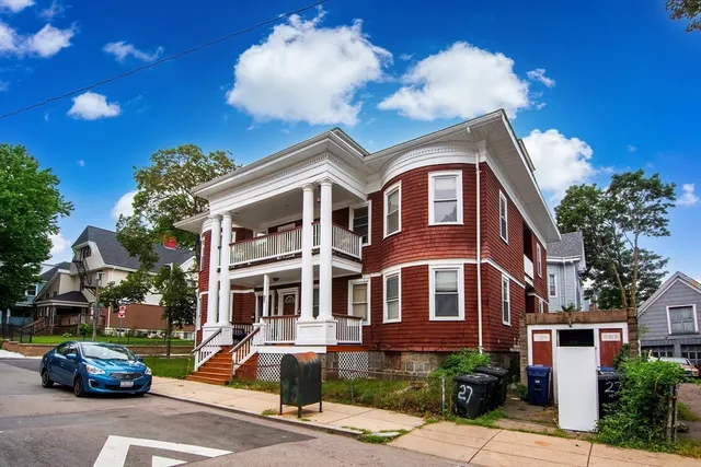 a front view of a house with street