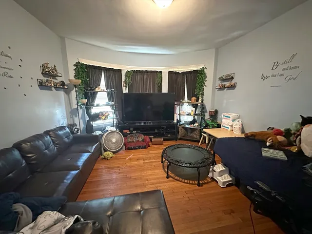 a room with furniture and a flat screen tv