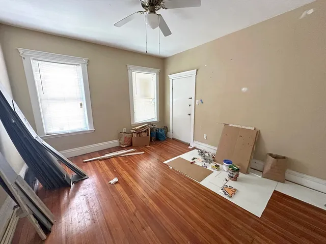 a bed room with a bed and a window