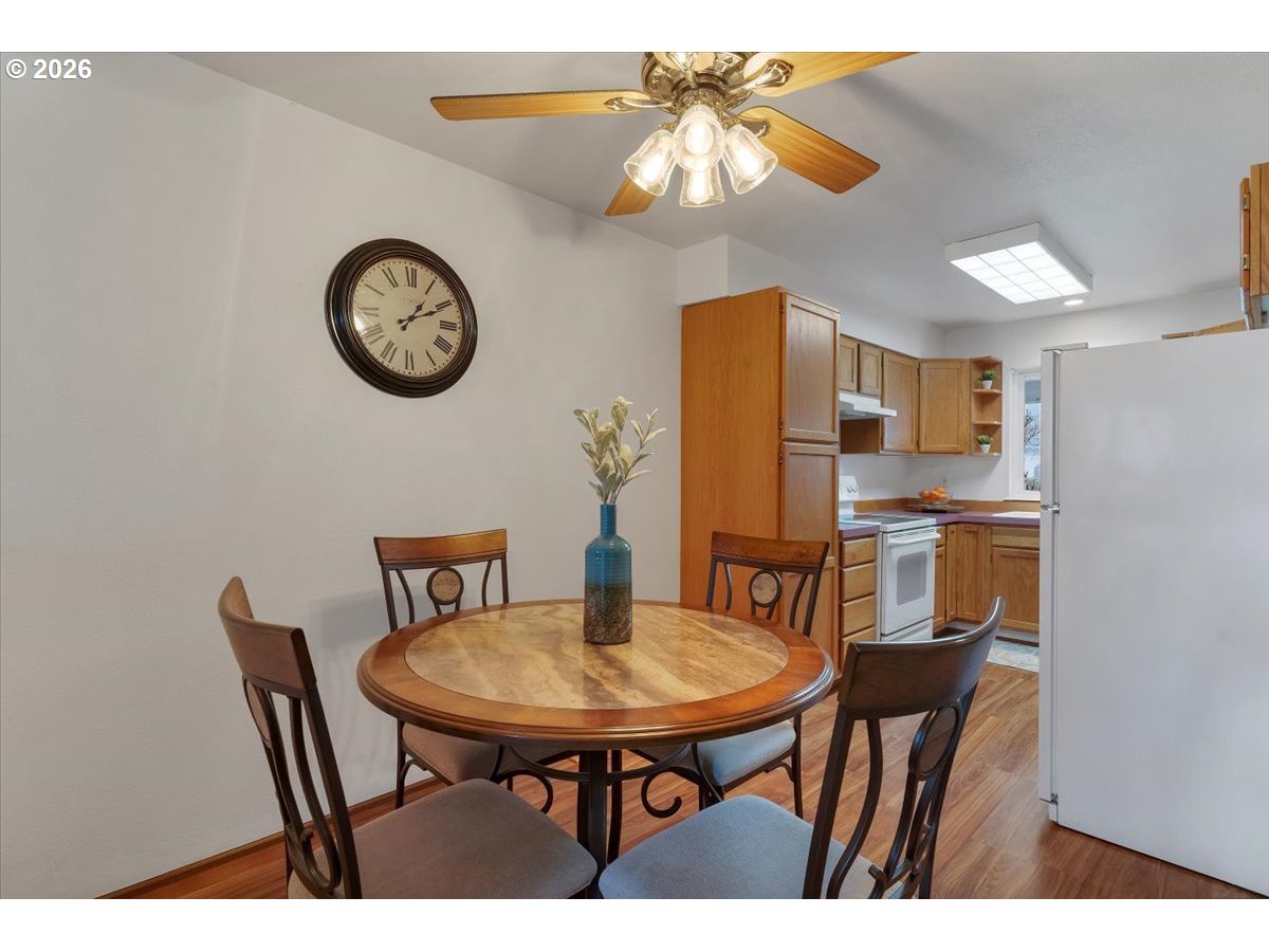 468 Harris Lane Oregon City, OR 97045 - Photo 11 of 34 a view of a dining room with furniture and a chandelier