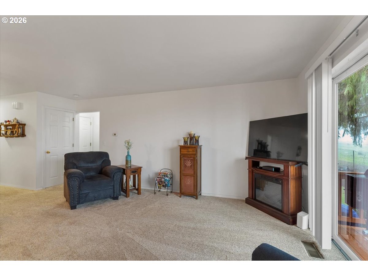 468 Harris Lane Oregon City, OR 97045 - Photo 15 of 34 a living room with furniture and a flat screen tv