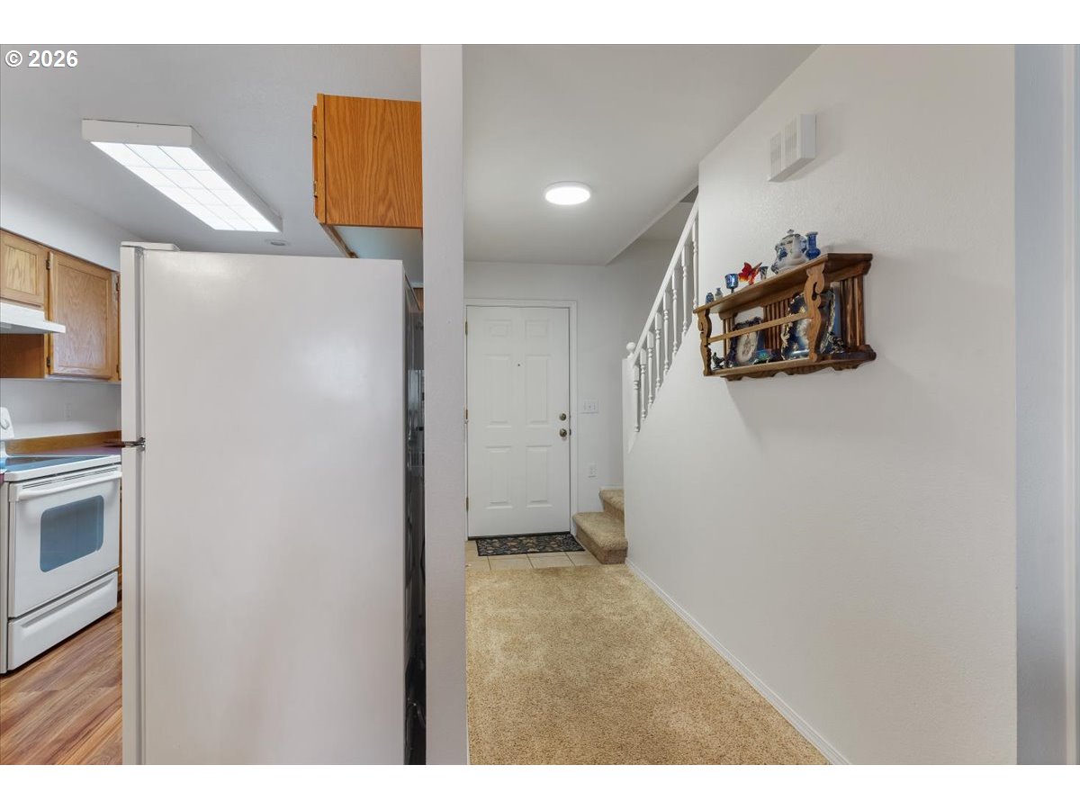 468 Harris Lane Oregon City, OR 97045 - Photo 6 of 34 a view of a refrigerator in kitchen and a sink