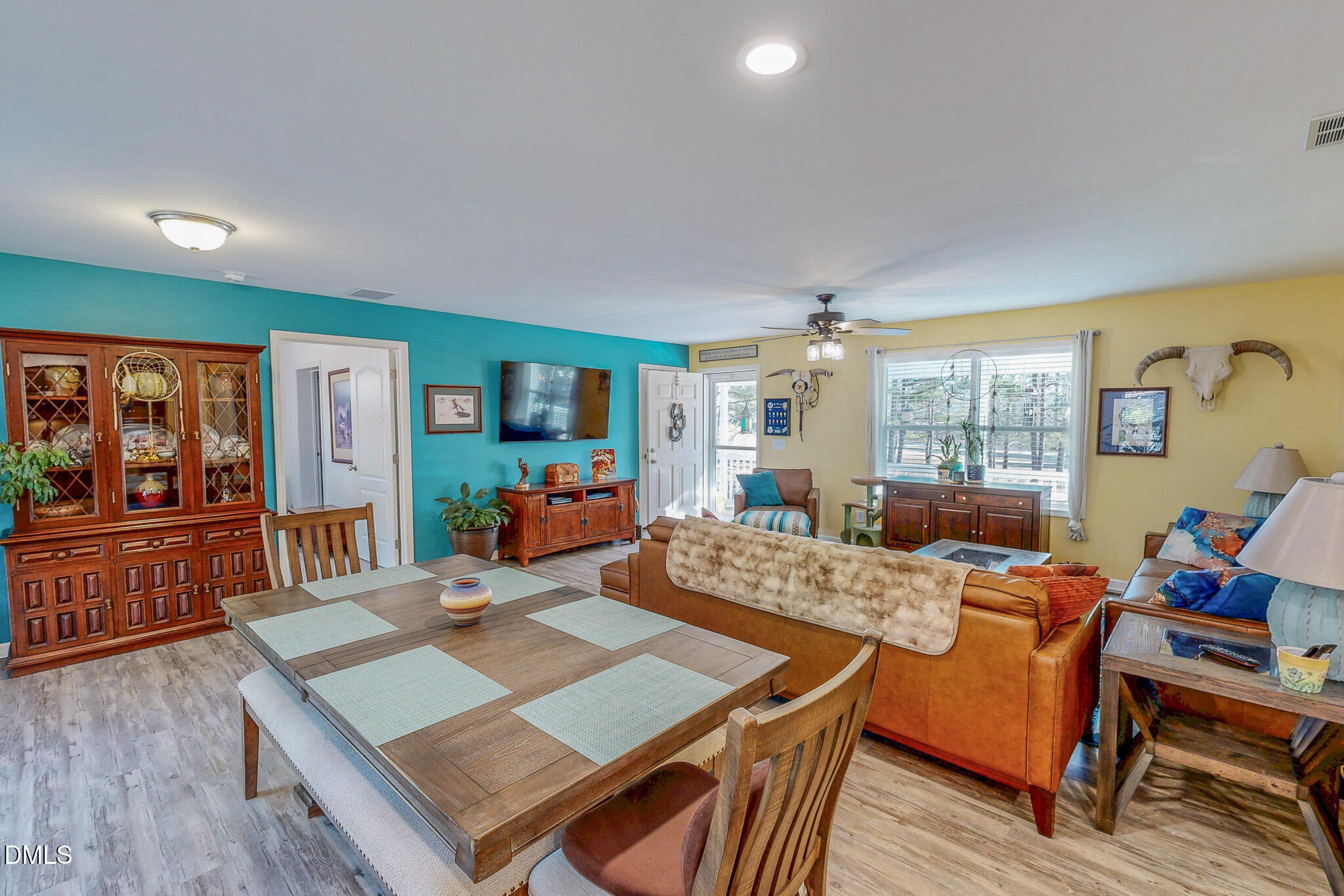 125 Ninovan Place Rougemont, NC 27572 - Photo 14 of 55 a view of a dining room with furniture window and wooden floor