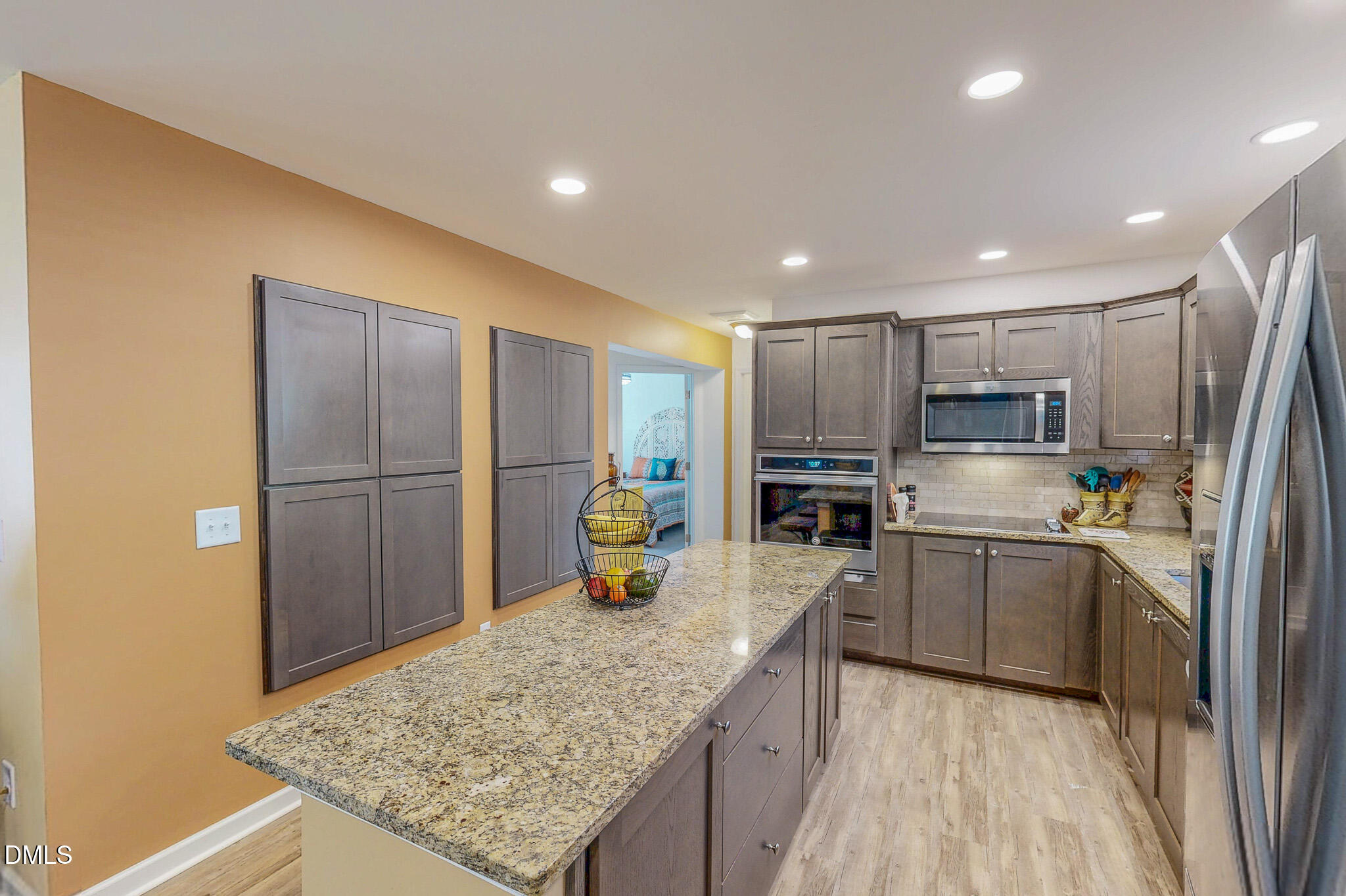 125 Ninovan Place Rougemont, NC 27572 - Photo 15 of 57 a kitchen with stainless steel appliances granite countertop a sink refrigerator and cabinets