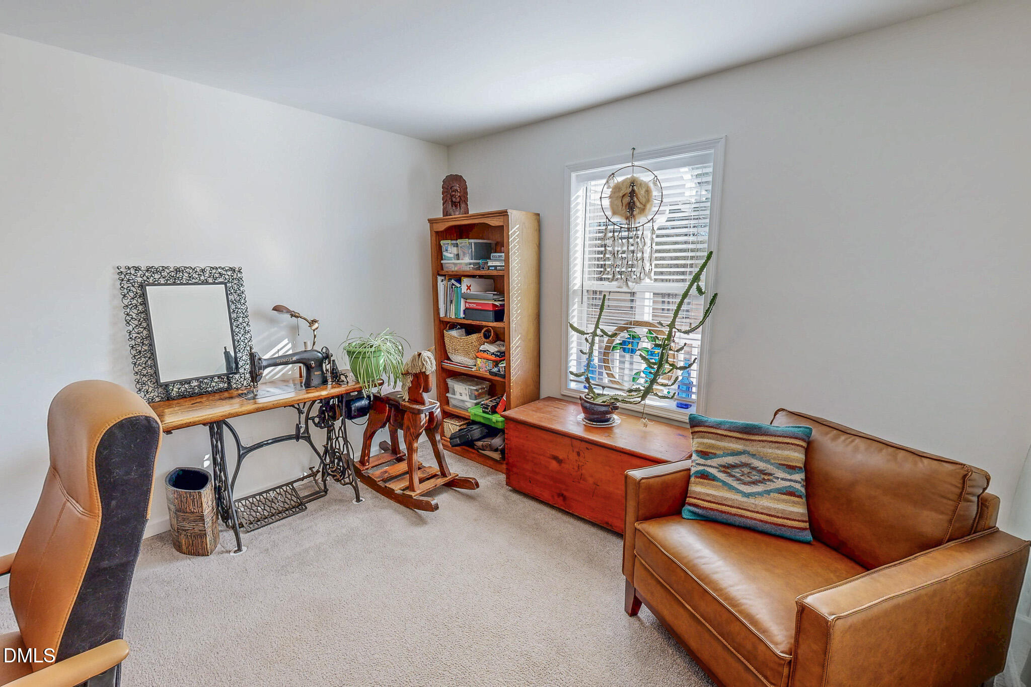 125 Ninovan Place Rougemont, NC 27572 - Photo 37 of 55 a living room with furniture a couch and a window