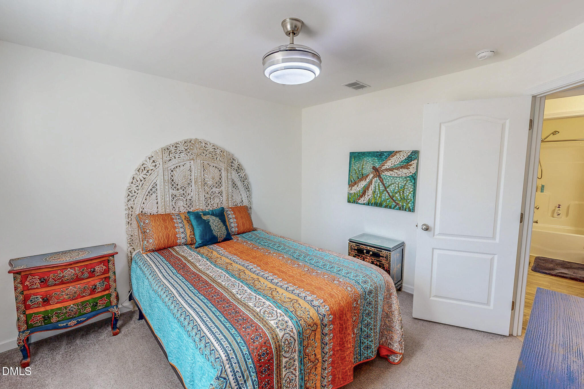 125 Ninovan Place Rougemont, NC 27572 - Photo 43 of 57 a bedroom with a bed and a chandelier