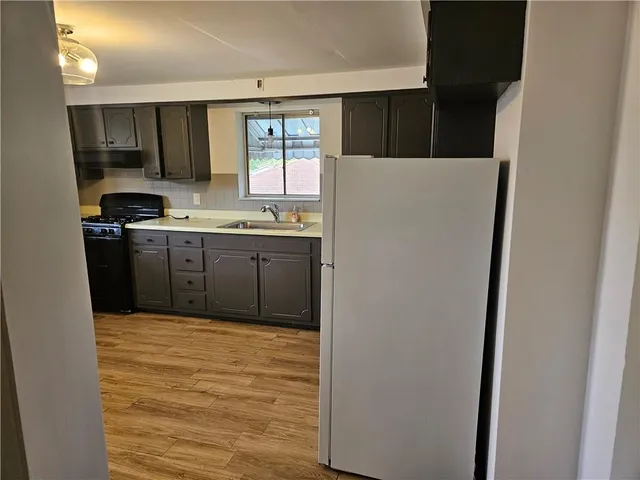 a view of a kitchen with electric appliances