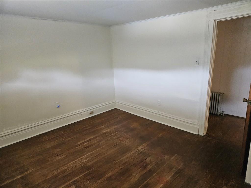 537 6th Street Braddock, PA 15104 - Photo 25 of 38 an empty room with wooden floor and windows