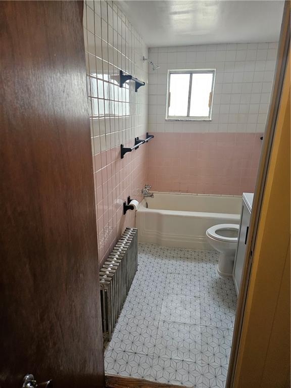 537 6th Street Braddock, PA 15104 - Photo 26 of 38 a bathroom with a tub shower and toilet