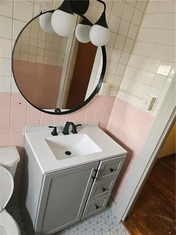 a bathroom with a toilet and a sink