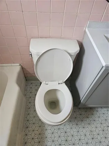 an empty room with wooden floor