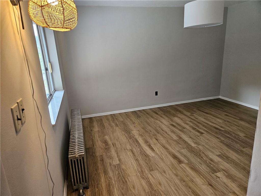 537 6th Street Braddock, PA 15104 - Photo 3 of 38 a view of a room with wooden floor and staircase