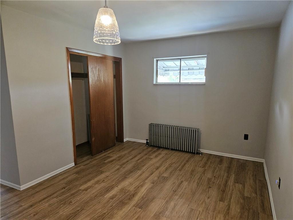 537 6th Street Braddock, PA 15104 - Photo 8 of 38 wooden floor in an empty room with a window