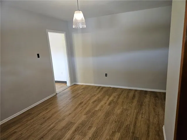 a large kitchen with granite countertop a cabinets and a sink