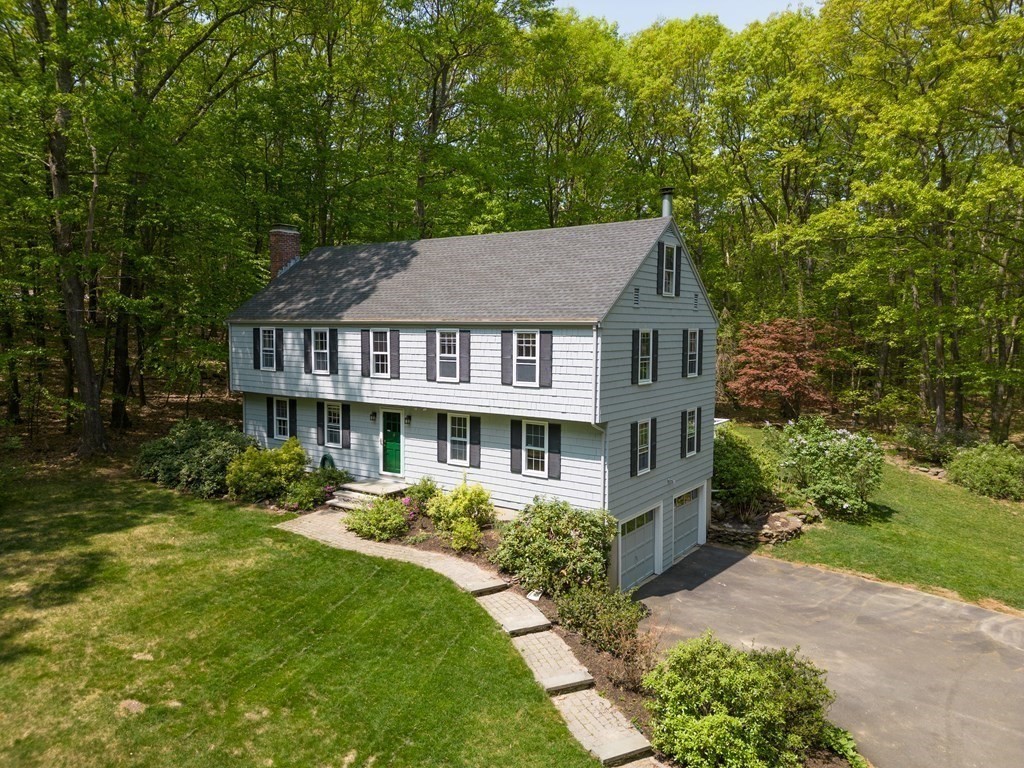 21 Adams Road Boxford, MA 01921 - Photo 1 of 40 a front view of a house with a garden