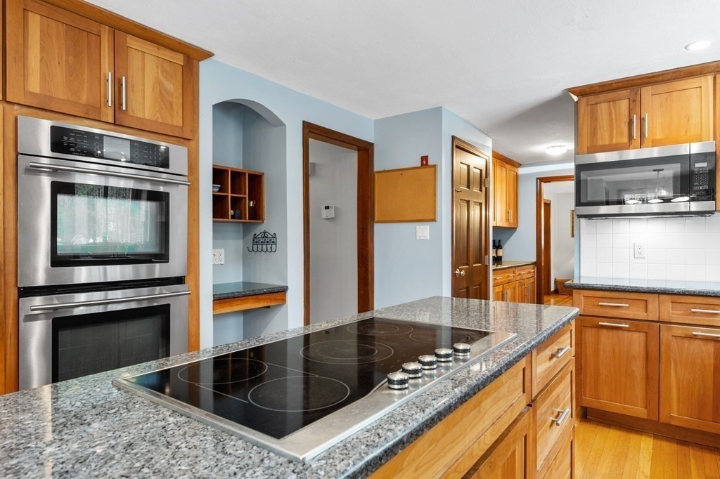 21 Adams Road Boxford, MA 01921 - Photo 4 of 40 a kitchen with granite countertop a sink and stainless steel appliances