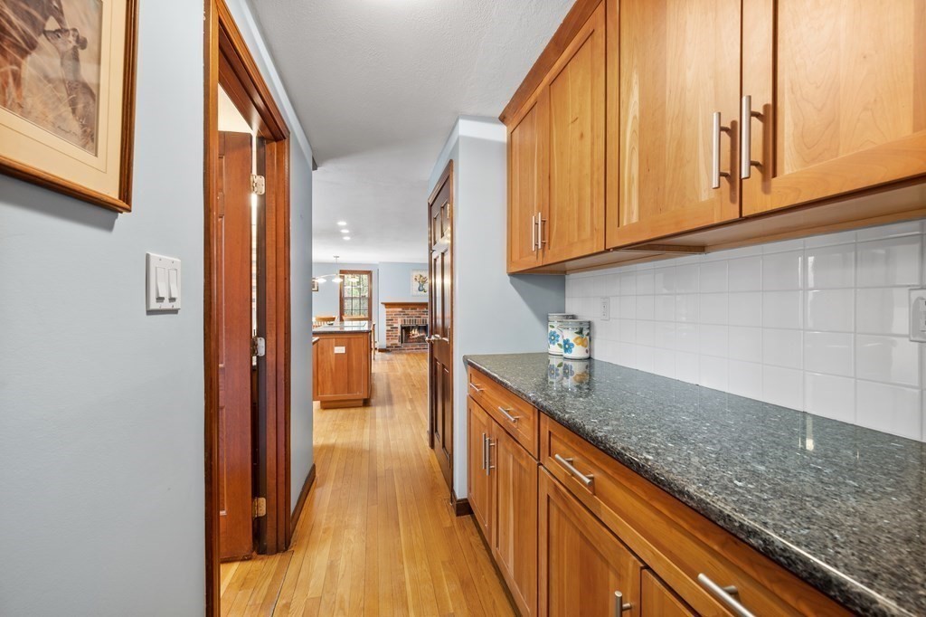 21 Adams Road Boxford, MA 01921 - Photo 7 of 40 a kitchen with stainless steel appliances granite countertop a sink and dishwasher with wooden floor