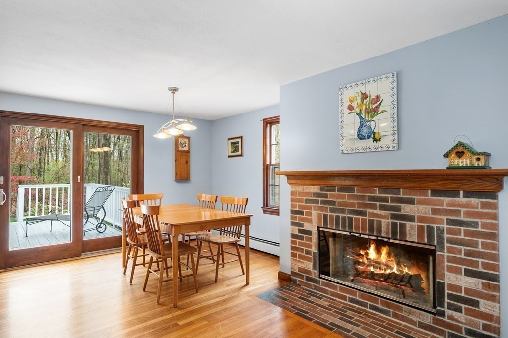 21 Adams Road Boxford, MA 01921 - Photo 8 of 40 a view of a dining room with furniture window and wooden floor