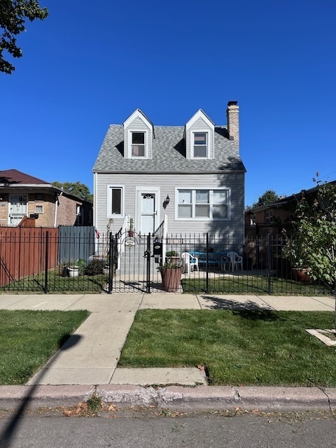 3618 West 65th Place Chicago, IL 60629 - Photo 1 of 1 a front view of house with yard and green space