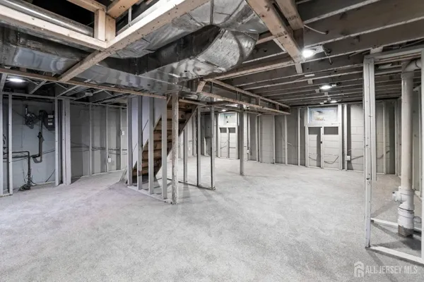 a view of an empty room with wooden walls