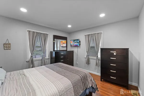 a bedroom with a bed and a dresser