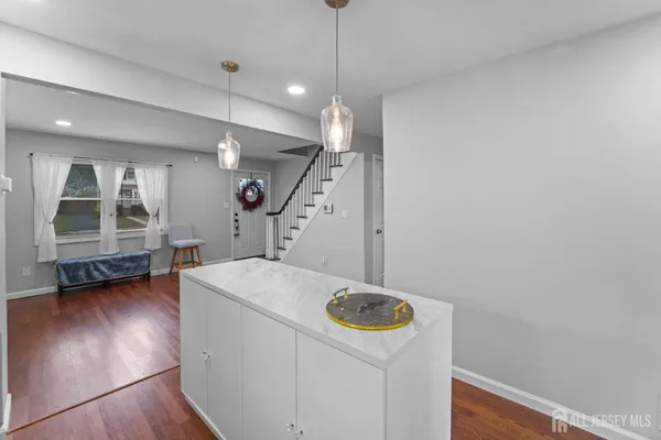 a view of a storage & utility room with wooden floor